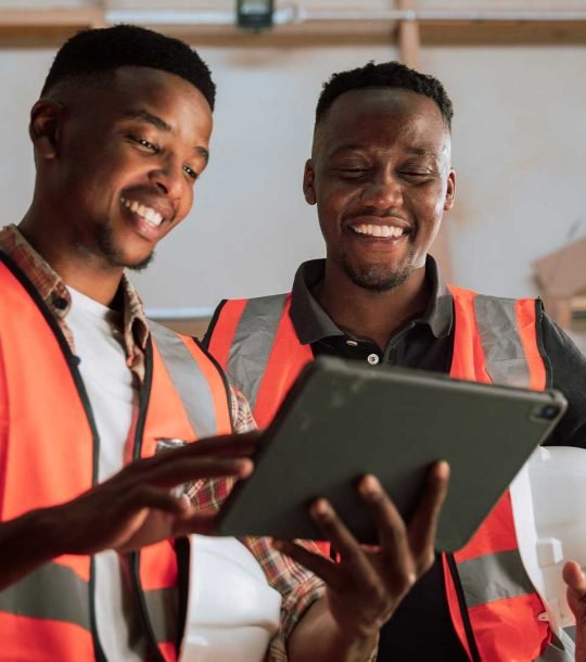 african-factory-workers-discussing-maintenance-digital-tablet-at-ziv-engineering african-factory-workers-discussing-maintenance-digital-tablet-at-ziv-engineering