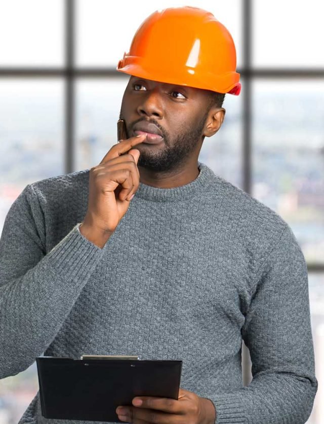 architect-holding-hand-near-chin-thougtful-engineer-with-protective-helmet-clipboard architect-holding-hand-near-chin-thougtful-engineer-with-protective-helmet-clipboard